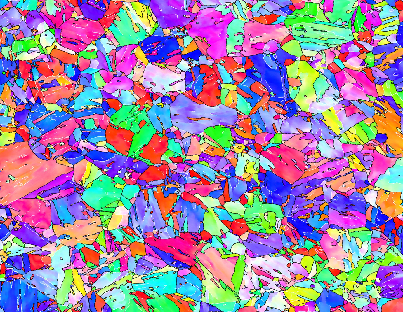 Color-coded microscopic microstructure image of a complex phase steel showing different steel phases in bright colors such as pink, green, blue and yellow – visualizes the complex microstructure of the material.