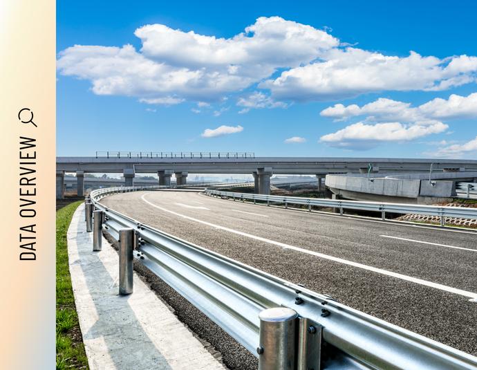 Highway intersection with bridges and overpasses Multi-lane highway intersection with bridges and overpasses under a cloudy sky.